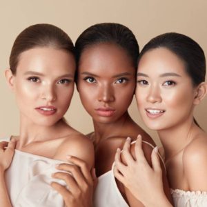 Three women with different skin types looking young after skin treatments.