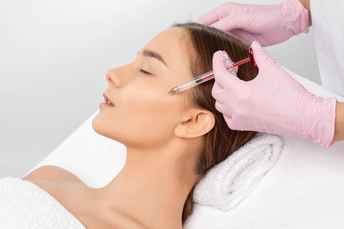 Woman getting dermal fillers to change aging effects
